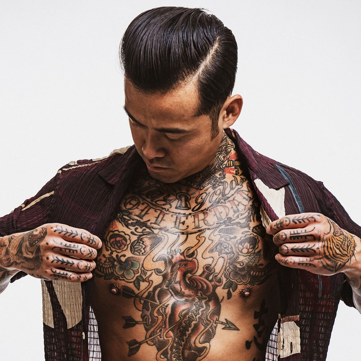Reuzel TAT Hydrabalm tattoo aftercare product in a sleek jar, designed to moisturize and protect fresh tattoos.