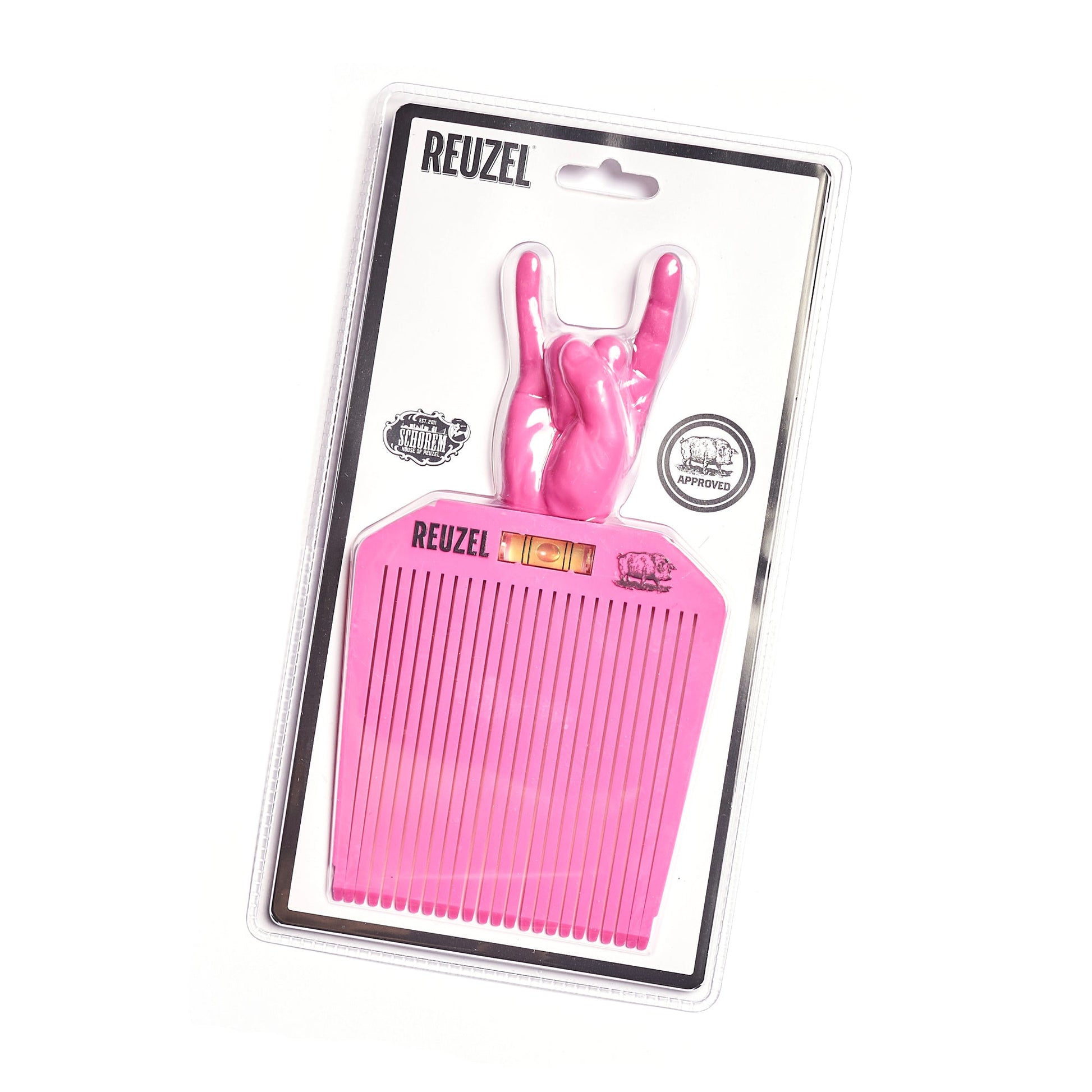 Pink flat top comb in REUZEL and Schorem packaging on a white background